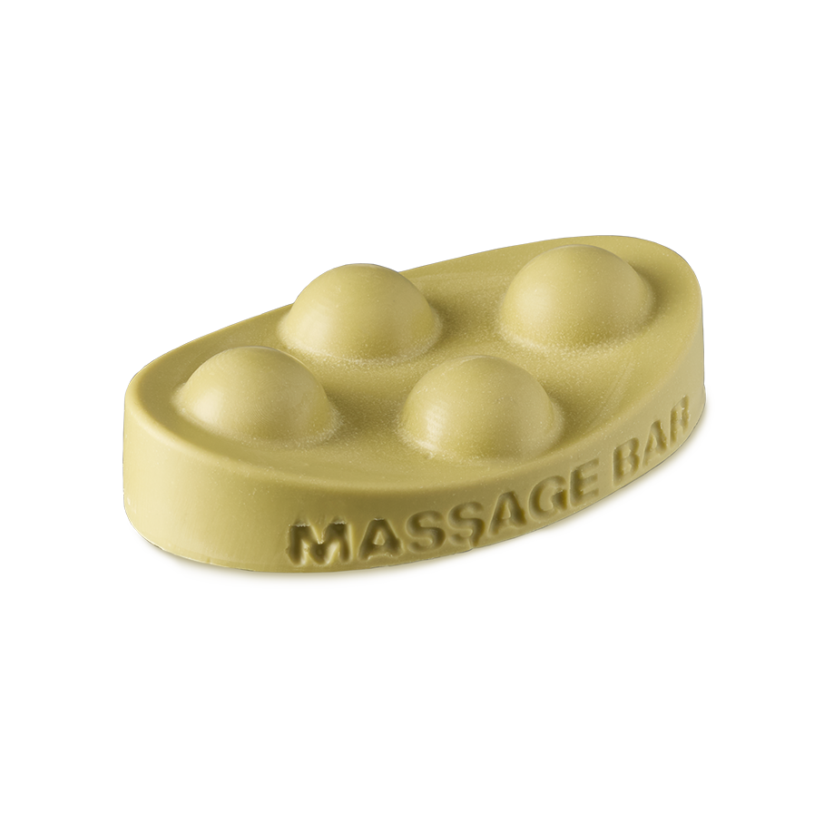 Brazilian Boom. An ivory-yellow, solid oil massage bar in an oval shape. The words "massage bar" are embossed on the side and there are four raised half-sphere, bubble-type shapes on top.