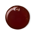 Sticky Dates, a circular swatch of shower gel that's scarlet red in colour.