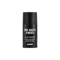 The Bee's Knees. A short, cylindrical black push-up tube of The Bee's Knees solid perfume with a black label on the front covering the cap, with the product name and scent printed on it.
